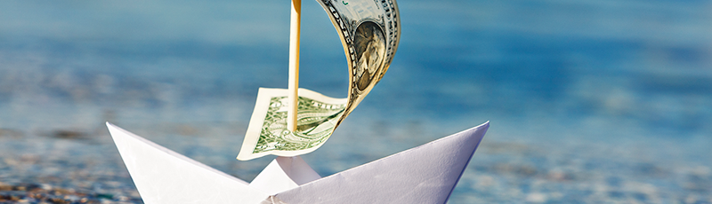 paper sailboat distracting you from reporting overseas assets to irs