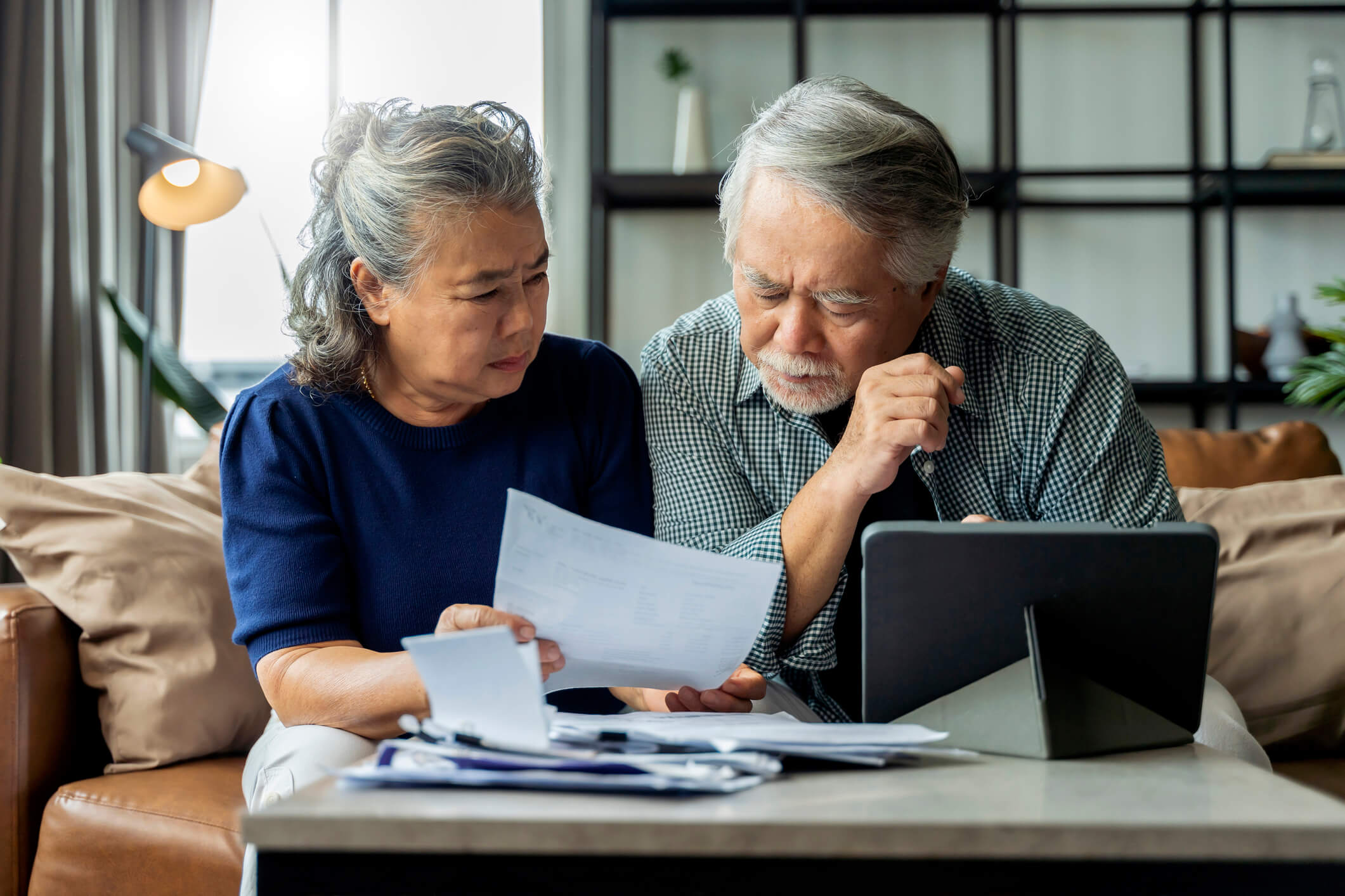 upset couple reading notice of deficiency