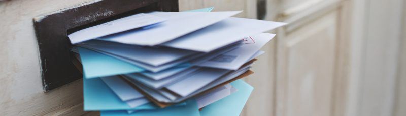 stack of letters about irs tax debt