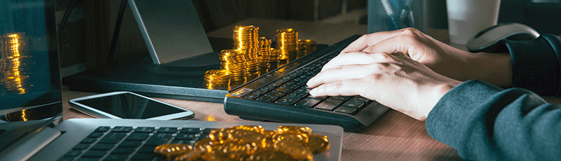 person calculating bitcoin taxes on laptop