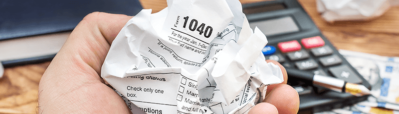 crumpled paper from withholding tax mistake