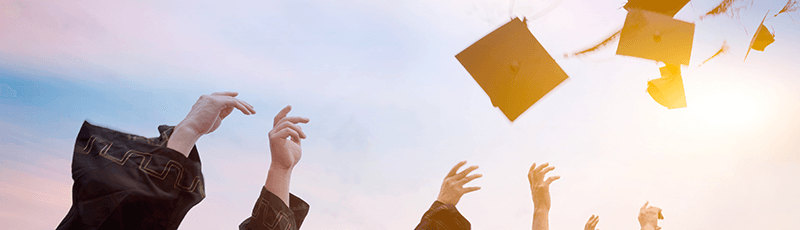 graduation cap flying in celebration of scholarships for high school seniors