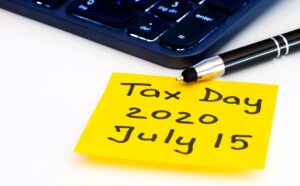 Sticky note with new tax deadline date