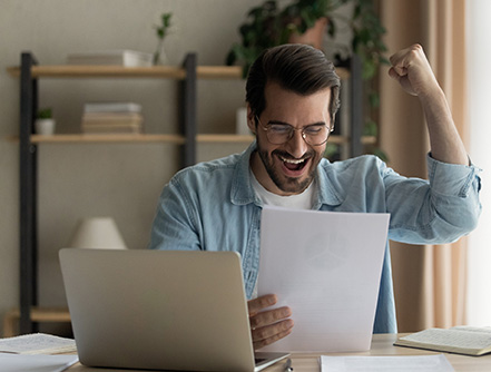 guy excited for his small business taxes