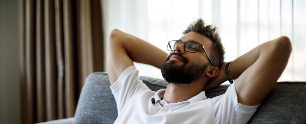 man relaxing thanks to student loan relief