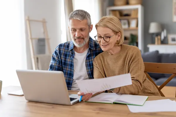 senior couple going over their personal loans