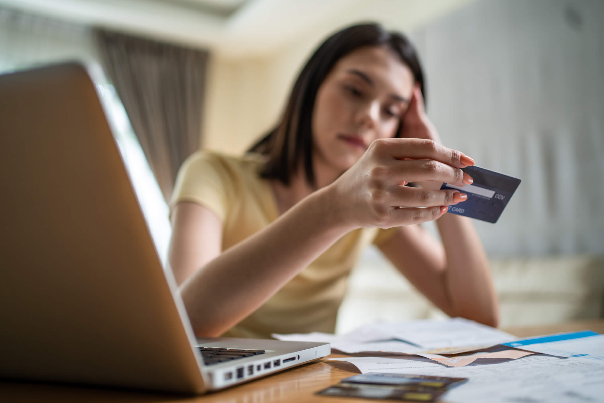 woman in debt trouble thinking about getting help